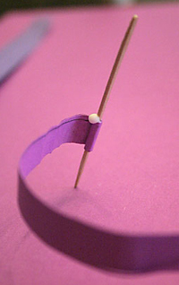 paper wrapping around toothpick