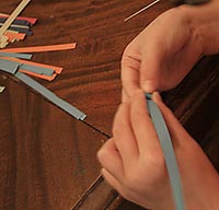 photo: hands rolling the quilling paper