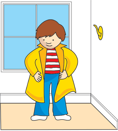 Boy putting yellow coat on.